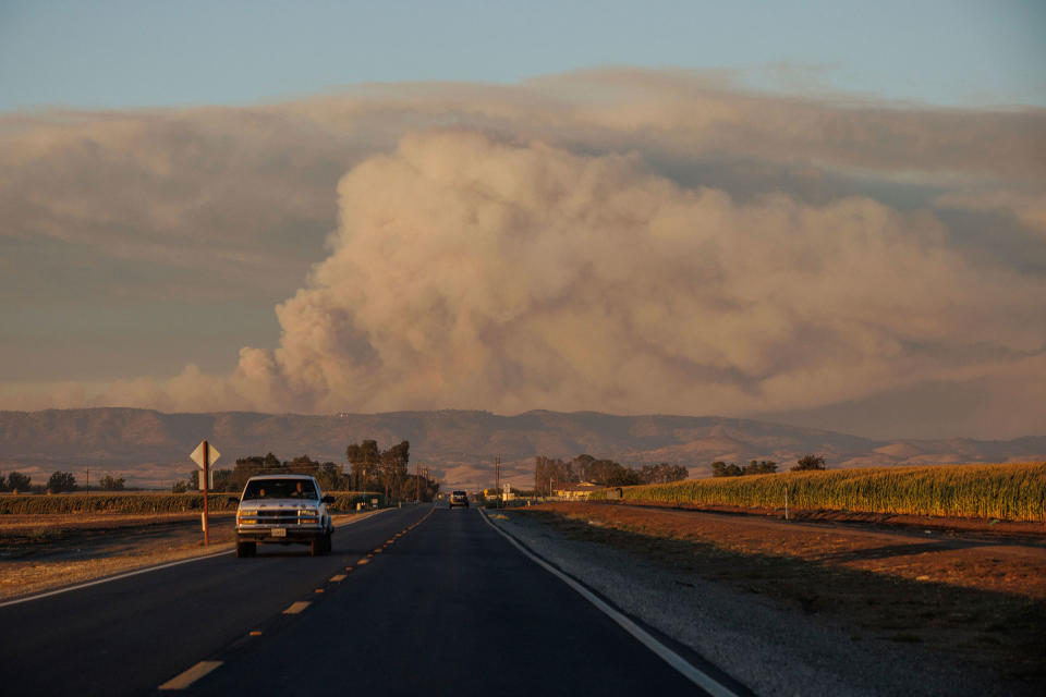 The Oak Fire seen from Highway 140 burns in Mariposa County, on July 22.<span class="copyright">Ethan Swope—San Francisco Chronicle/AP</span>