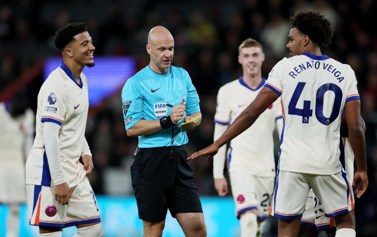 Anthony Taylor dishes out another yellow card.