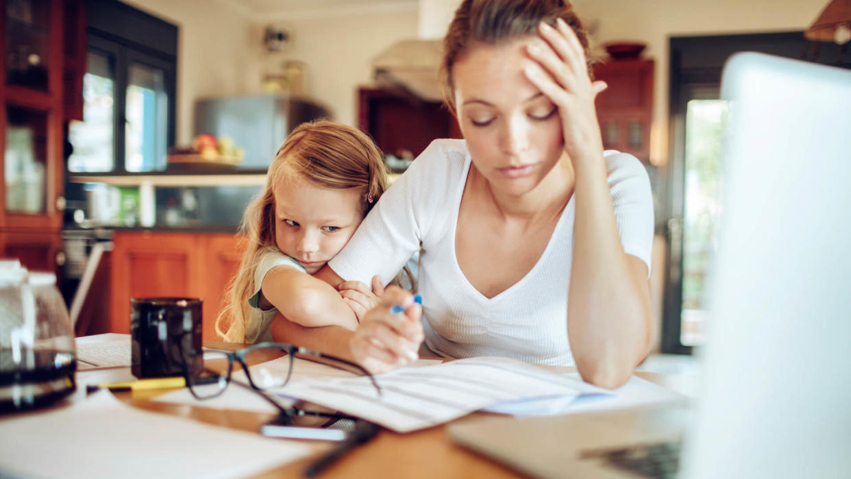 Close up of a mother going through her financials.