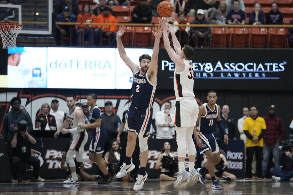 Pacific guard Judson Martindale (33) shoots a 3-point basket over Gonzaga forward Drew Timme (2) during the first half of an NCAA college basketball game in Stockton, Calif., Saturday, Jan. 21, 2023. (AP Photo/Godofredo A. Vásquez)
