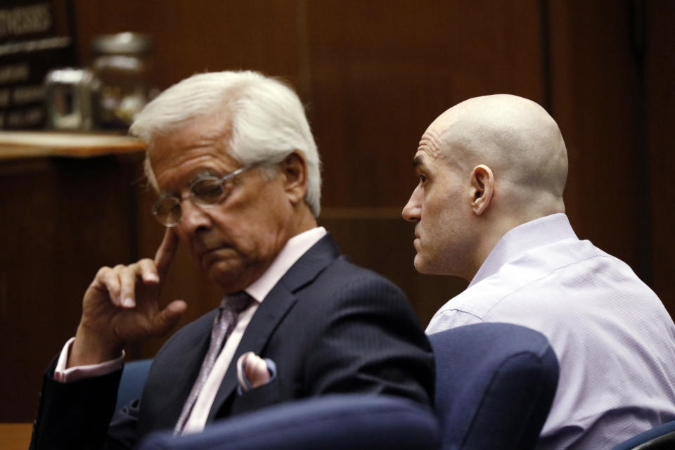 Michael Gargiulo, right, and his attorney Daniel Nardoni listen as Gargiulo's guilty verdicts on all counts are read in Los Angeles Superior Court Thursday, Aug. 15, 2019. A jury found Gargiulo guilty of fatally stabbing two women and attempting to kill a third in their Southern California homes. Gargiulo, is also awaiting trial for a similar killing in Illinois in 1993. (Al Seib/Los Angeles Times via AP, Pool)