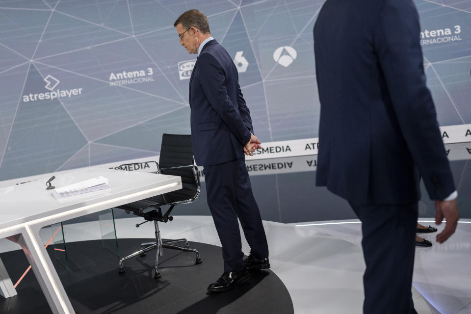 Popular Party candidate Nunez Feijóo, left, and Spain's Prime Minister and Socialist candidate Pedro Sánchez, right, prior to the televised live debate ahead of Spain's general election in Madrid, Spain, Monday, July 10, 2023. Spain's elections Sunday will be a battle between two leftist and two rightist parties that are teaming up to form possible coalitions. Tipped to lead his right-wing Popular Party to victory, Alberto Núñez Feijóo, 62, has had a meteoric rise in popularity since he took charge of the party in April, 2022 following an internal feud that toppled his predecessor Pablo Casado. (AP Photo/Bernat Armangue)