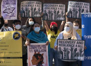 FILE - In this Nov. 9, 2020, file photo, demonstrators with the New York Immigration Coalition rally asking President-elect Joe Biden to prioritize immigration reform in New York. Immigrant rights activists energized by a new Democratic administration and majorities on Capitol Hill are gearing up for a fresh political battle to push through a proposed bill from Biden that would open a pathway to citizenship for up to 11 million people. (AP Photo/Mark Lennihan, File)