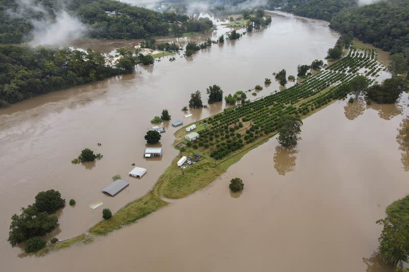 Drone picture of orange orchards and houses that are submerged near Hawkesbury River in northwestern Sydney