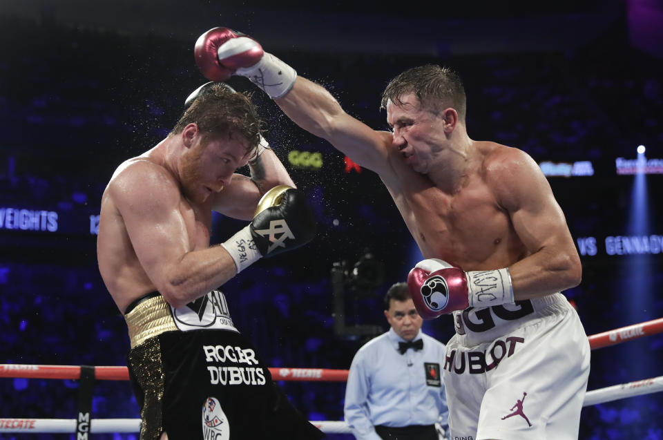 Canelo Alvarez, left, and Gennady Golovkin trade punches in the seventh round during a middleweight title boxing match, Saturday, Sept. 15, 2018, in Las Vegas. (AP Photo/Isaac Brekken)