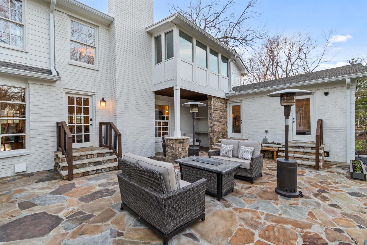 The spacious property features a flagstone patio at 8202 Foxview Court.