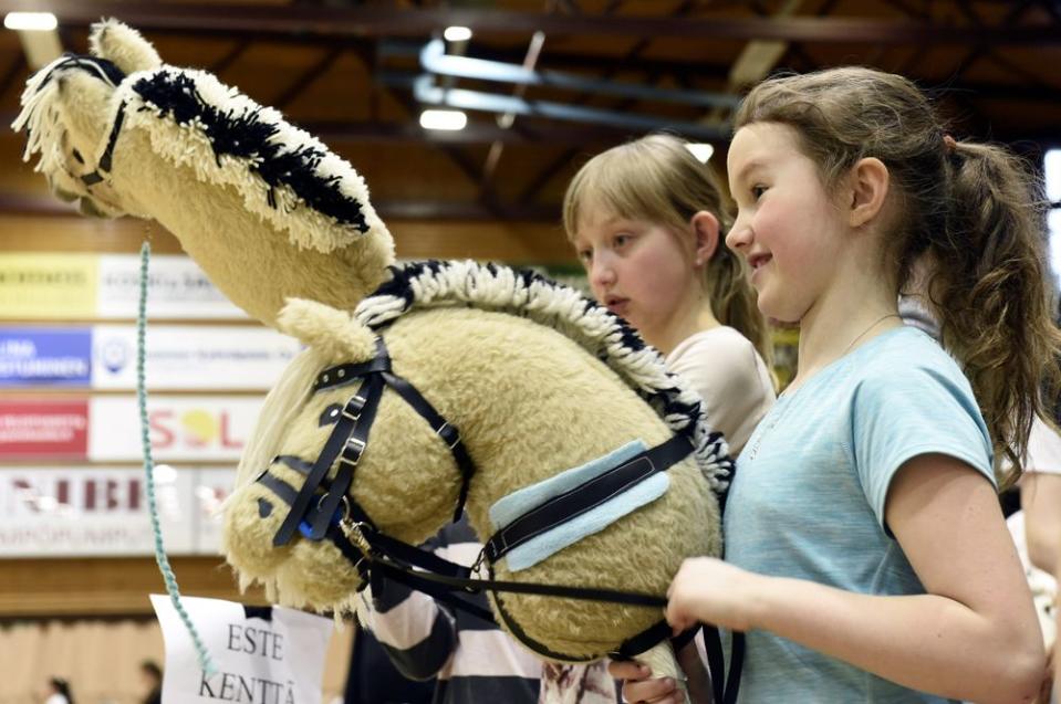 Young Girls In Finland Are Pretending to Ride Horses