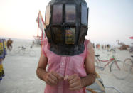 <p>Derek Schoonmaker walks on the playa with his helmet made of android phones as approximately 70,000 people from all over the world gathered for the annual Burning Man arts and music festival in the Black Rock Desert of Nevada, Sept. 1, 2017. (Photo: Jim Urquhart/Reuters) </p>