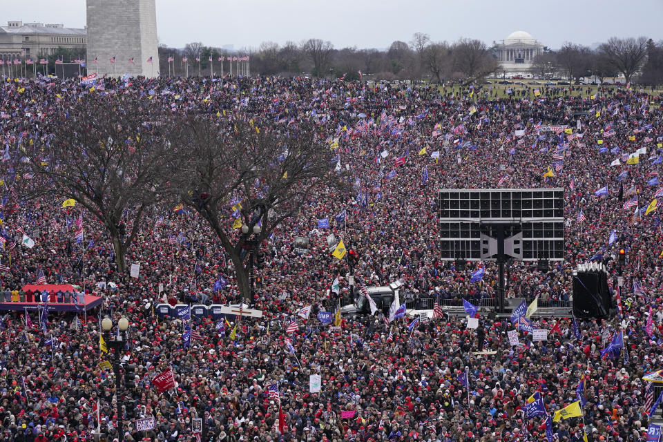 FILE - With the Washington Monument in the background, people attend a rally in support of President Donald Trump near the White House on Wednesday, Jan. 6, 2021, in Washington. An original script for Donald Trump’s speech the day after the Capitol insurrection included lines asking the Justice Department to “ensure all lawbreakers are prosecuted to the fullest extent of the law’ and stating the rioters “do not represent me,” but those references were deleted and never spoken, according to exhibits released by House investigators on Monday. (AP Photo/Jacquelyn Martin, File)