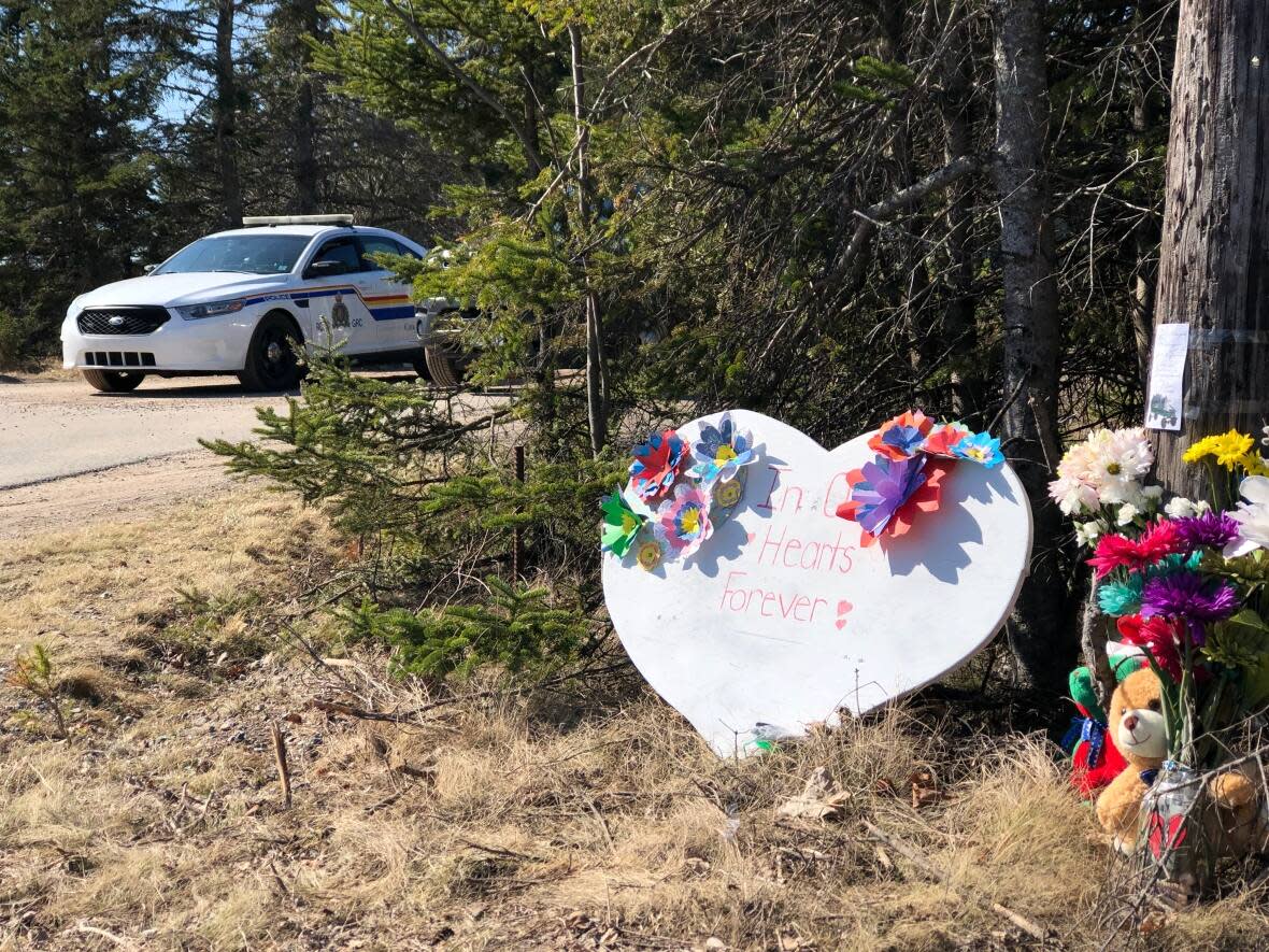 A memorial at the top of Portapique Beach Road. in Portapique, N.S., on April 21, 2020. (Craig Paisley/CBC - image credit)