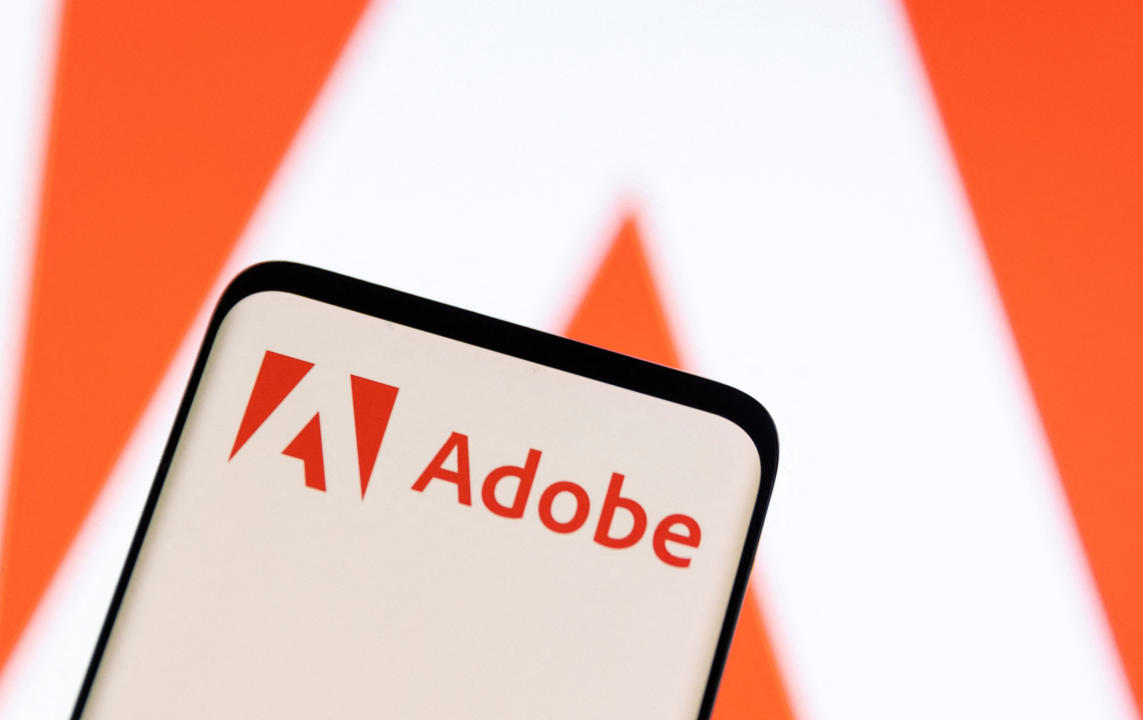 FILE PHOTO: Adobe logo is seen on smartphone in this illustration taken June 13, 2022. REUTERS/Dado Ruvic/Illustration/File Photo