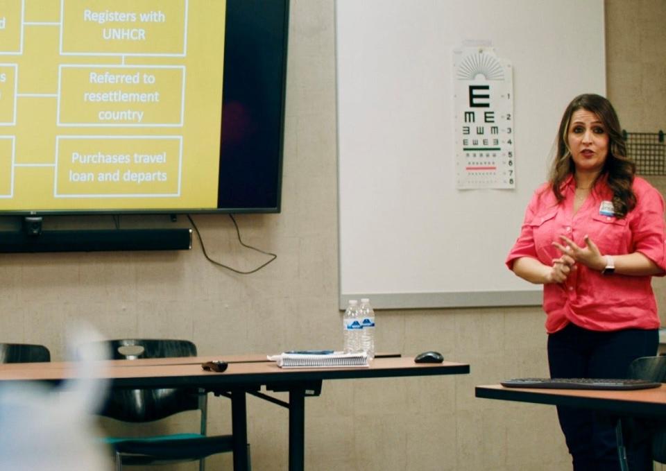 Zainab Al-Fatlawi trains new volunteers for the Nashville Neighbors program, which helps refugees settle in Tennessee, at nonprofit Siloam Health in spring 2023