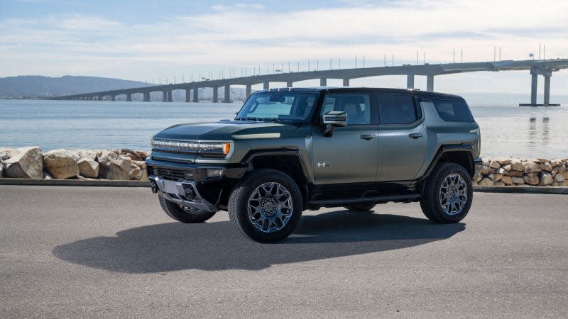 A photo of a green GMC Hummer EV SUV. 