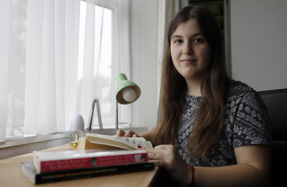 A-Level student and would be medical student Kaya Ilska, who is disappointed with her teacher predicted exam results, at home in London, Wednesday, Aug. 19, 2020. Thousands of graduating high school students in Britain are scrambling for university places following the government’s disastrous decision to award final grades using an unfair algorithm to replace exams canceled because of the coronavirus, resulting in mass confusion. Ilska was confident of excelling in her A Level exams but has been robbed of the opportunity. (AP Photo/Kirsty Wigglesworth)