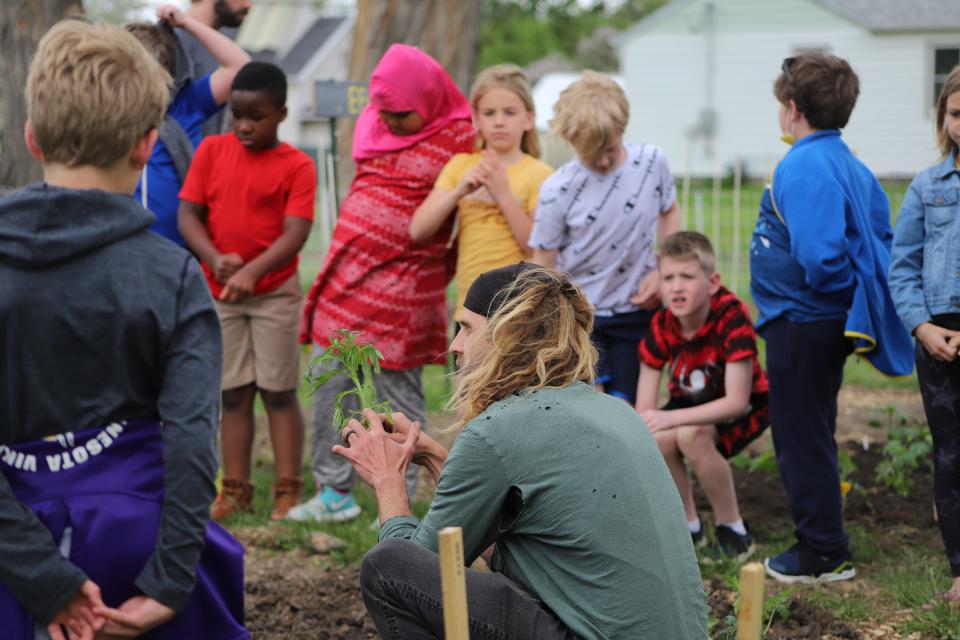 Megan and Dan EisenVos, owners of the new nonprofit IronFox Farm, started a program with third- and fourth-graders from Eugene Field A+ Elementary where they teach the students about gardening. The students planted vegetables on the IronFox lot in Sioux Falls on Tuesday, May 17.