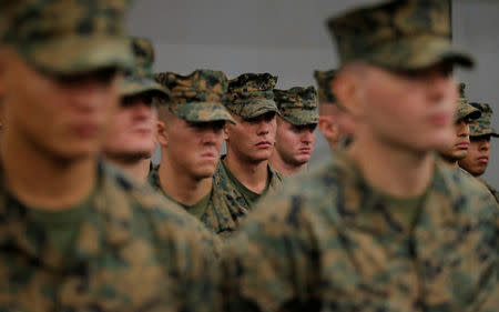 FILE PHOTO - U.S. Marines aboard the USS Bonhomme Richard amphibious assault ship stand in formation during a ceremony marking the start of Talisman Saber 2017, a biennial joint military exercise between the United States and Australia aboard the USS Bonhomme Richard amphibious assault ship on the the Pacific Ocean off the coast of Sydney, Australia, June 29, 2017. REUTERS/Jason Reed/File Photo