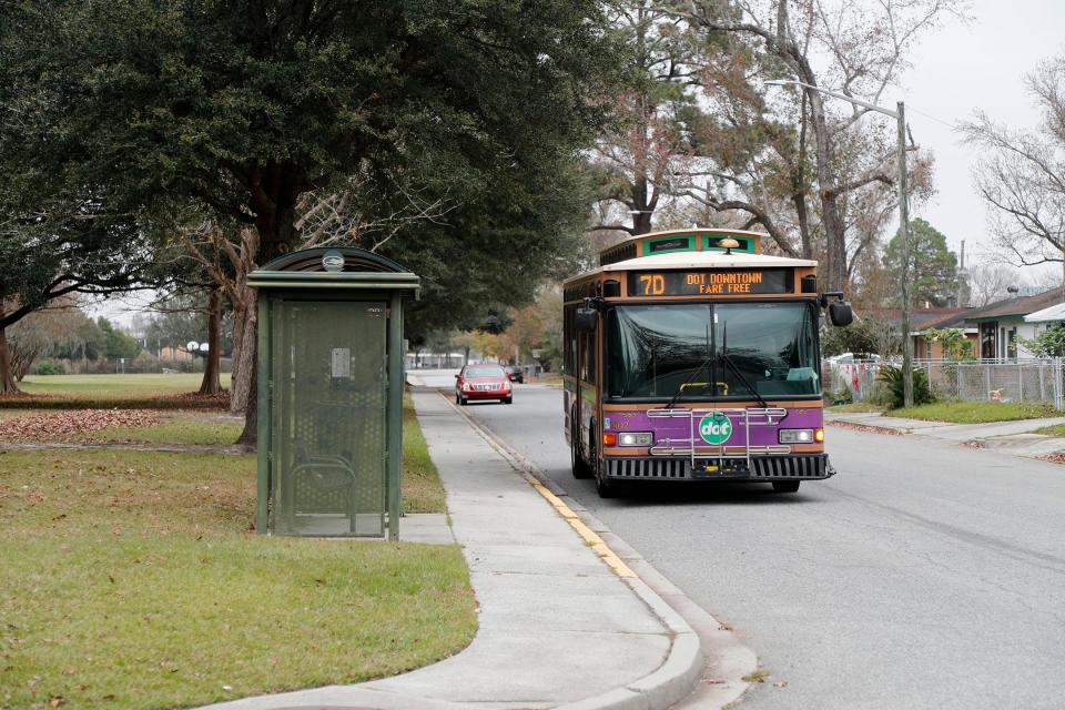 A dot shuttle pulls up to a stop in Carver Village. The free shuttle now has a route that includes both the Carver Village and Cloverdale neighborhoods.