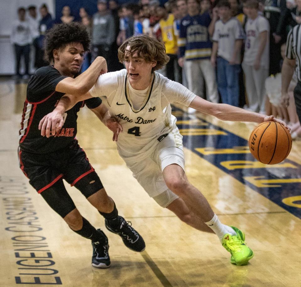 Harvard-Westlake's Christian Horry, left, son of seven-time NBA champion Robert Horry, defends against guard Dusty Stromer