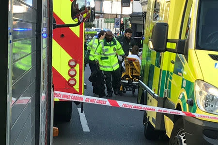 Emergency personnel attend to a person after an incident at Parsons Green underground station in London, Britain, September 15, 2017. REUTERS/Yann Tessier