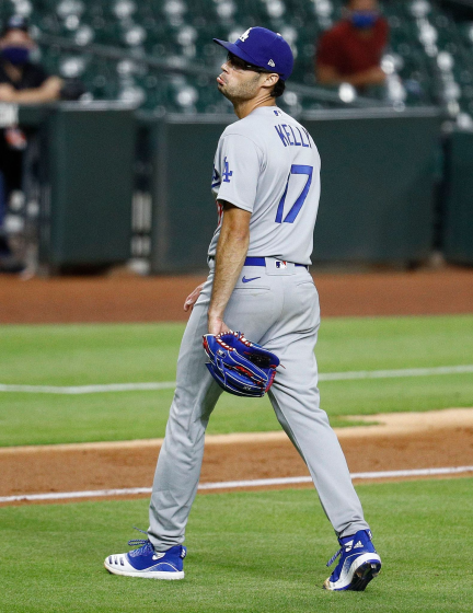 HOUSTON, TEXAS - JULY 28: Joe Kelly #17 of the Los Angeles Dodgers reacts.