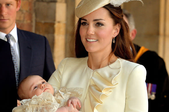 The Duchess of Cambridge carries her son Prince George after his Christening at the Chapel Royal in St James's Palace by the Archbishop of Canterbury in central London. 