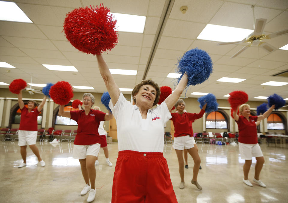Pat Weber, 81, leads the Sun City Poms cheerleader dancers as they rehearse in Sun City, Arizona, January 7, 2013. Sun City was built in 1959 by entrepreneur Del Webb as America?s first active retirement community for the over-55's. Del Webb predicted that retirees would flock to a community where they were given more than just a house with a rocking chair in which to sit and wait to die. Today?s residents keep their minds and bodies active by socializing at over 120 clubs with activities such as square dancing, ceramics, roller skating, computers, cheerleading, racquetball and yoga. There are 38,500 residents in the community with an average age 72.4 years. Picture taken January 7, 2013.  REUTERS/Lucy Nicholson (UNITED STATES - Tags: SOCIETY TPX IMAGES OF THE DAY)    ATTENTION EDITORS - PICTURE 20 OF 30 FOR PACKAGE 'THE SPORTY SENIORS OF SUN CITY'  SEARCH 'SUN CITY' FOR ALL IMAGES