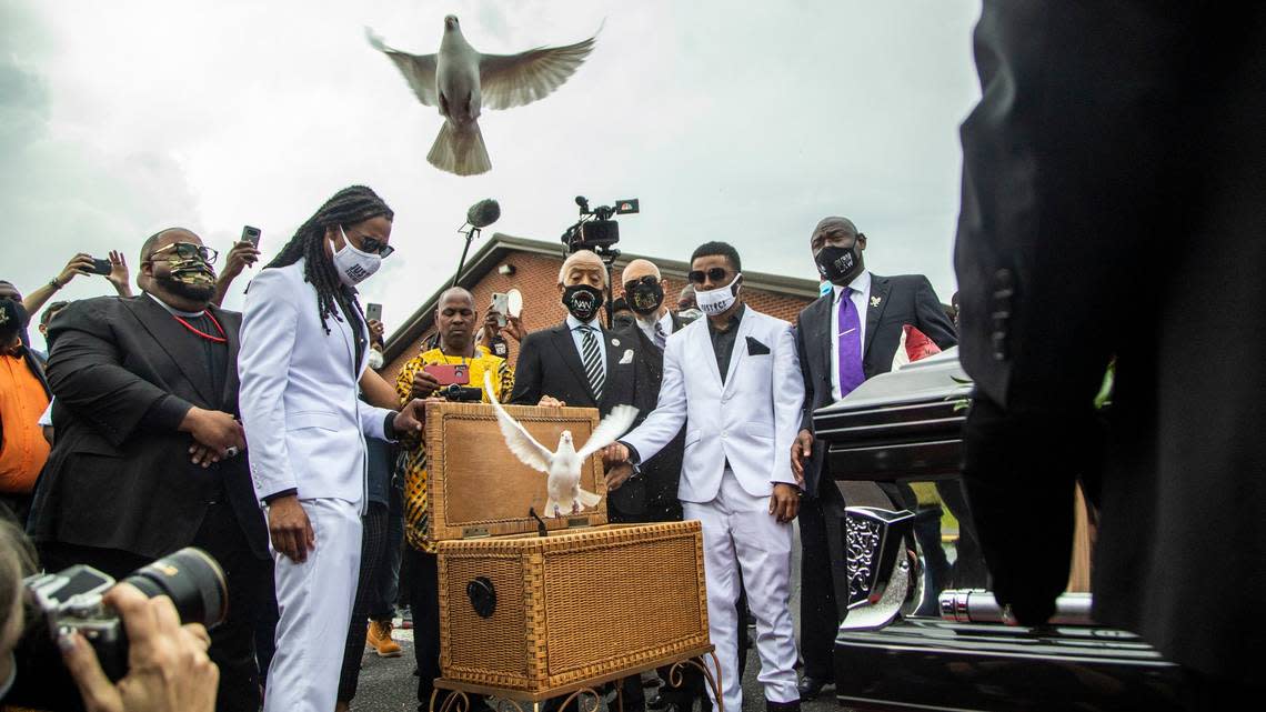 Andrew Brown Jr.’s sons Khalil Ferebee, left, and Jha’rod Ferebee release doves following their father’s funeral at the Fountain of Life Church in Elizabeth City, NC Monday, May 3, 2021. Brown was shot and killed by Pasquotank County Sheriff deputies in April.