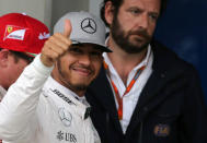 Formula One - F1 - Brazilian Grand Prix - Circuit of Interlagos, Sao Paulo, Brazil - 12/11/2016 - Mercedes' driver Lewis Hamilton of Britain celebrates pole position after qualifying session. REUTERS/Paulo Whitaker