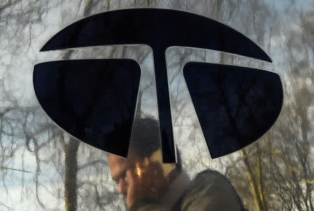 A man walks past a Tata sign outside their offices in London, Britain March 30, 2016. REUTERS/Toby Melville