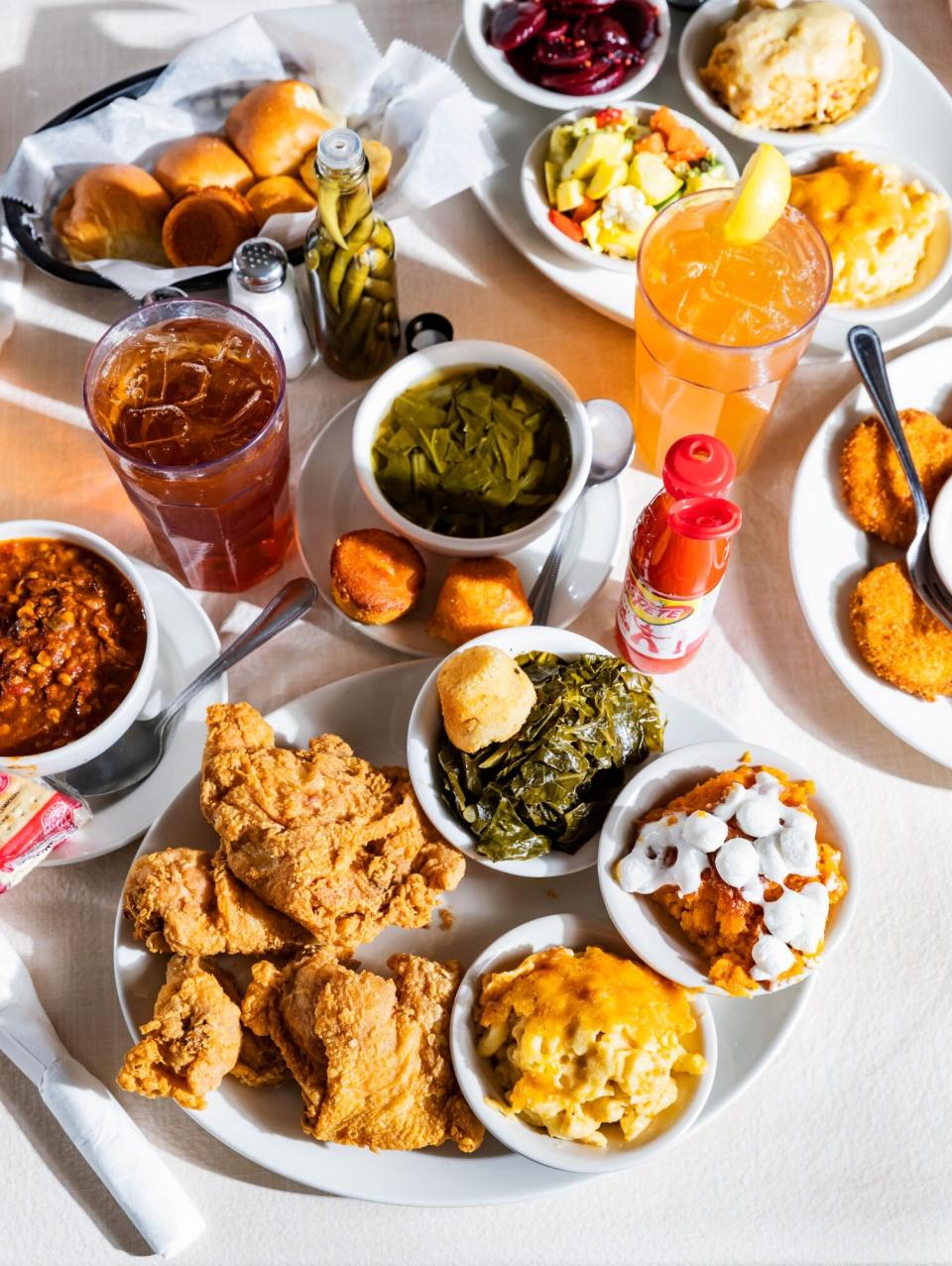 fried chicken, collard greens, sweet potato soufflé, and mac and cheese