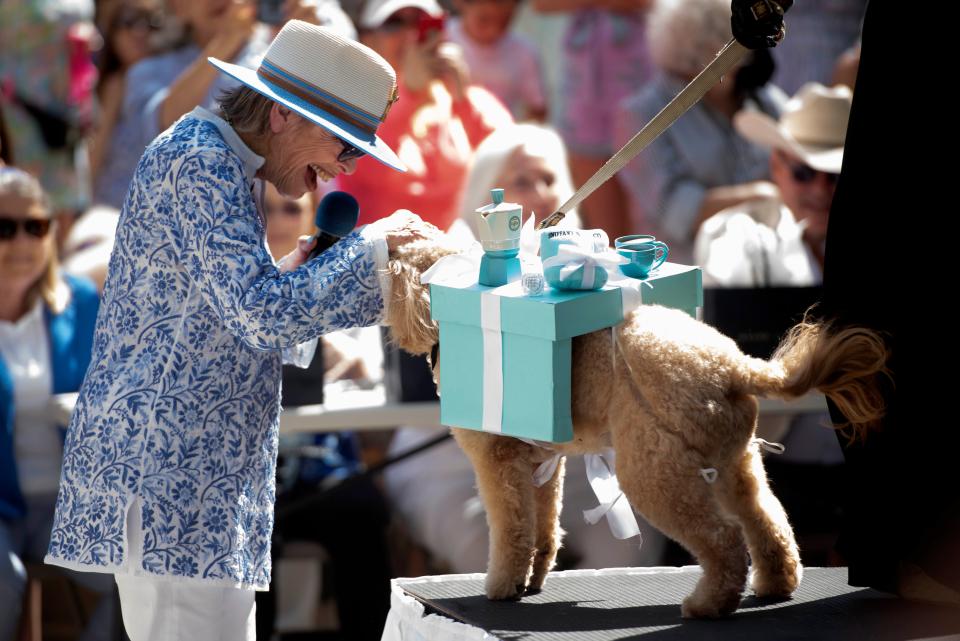 Mistress of ceremonies Sherry Frankel has a moment with Heather Jones' dog Sophie.