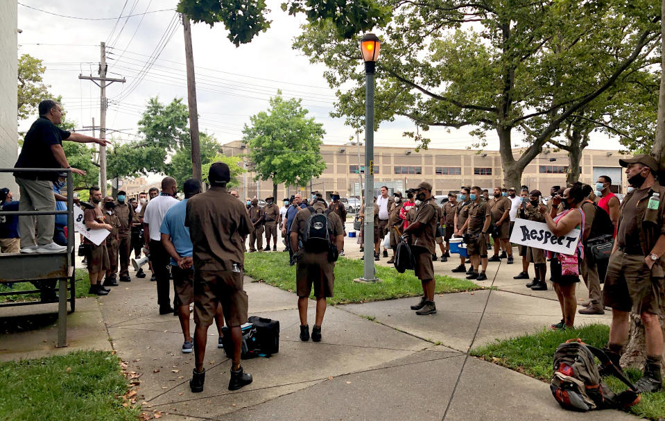 Local union president Vinnie Perrone, left, speaks to UPS workers at a protest of working conditions at their Brooklyn facility on July 24, 2020. (Adiel Kaplan / NBC News)