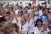 German supporters celebrate after Germany scored their first goal as they gather in the fan zone in Trafalgar Square to watch on a big screen the final of the Women's Euro 2022 soccer match between England and Germany being played at Wembley stadium in London, Sunday, July 31, 2022. (AP Photo/Frank Augstein)