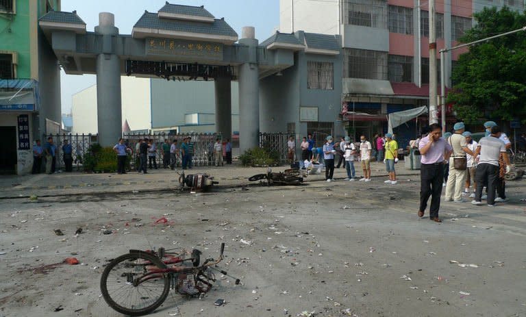 A damaged bicycle lies on the ground after an explosion outside a primary school in Guilin, southwest China's Guangxi province on September 9, 2013, which killed two people and injured 44 others, state-run media and a local official said