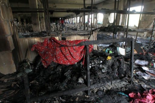 Burnt debris on the floor of the nine-storey Tazreen Fashion plant in Savar outside Dhaka on November 26, 2012. Bangladesh police fired rubber bullets to disperse thousands of workers who protested for a third day Wednesday over the nation's worst factory blaze which prompted the arrest of three plant managers