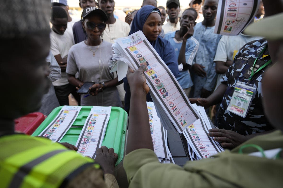 Electoral officials count ballots in front of party agents and observers at a polling station in Yola Nigeria, Saturday, Feb. 25, 2023. Voters in Africa’s most populous nation are heading to the polls Saturday to choose a new president, following the second and final term of incumbent Muhammadu Buhari. (AP Photo/Sunday Alamba)