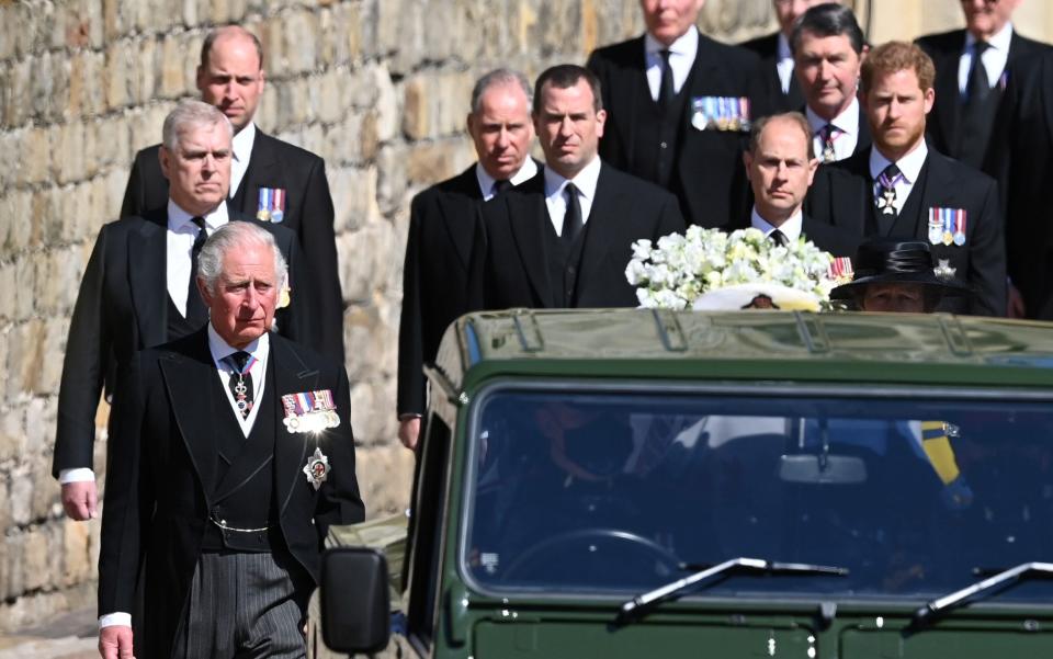 Members of the Royal family wear medals as the follow the Duke of Edinburgh's hearse at Windsor Castle - Hannah McKay/Reuters