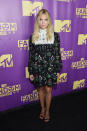 <p>The “<i>Pretty Little Liars” </i>actress channeled the '60s in a floral feminine minidress with a white bib and strappy heels.</p>