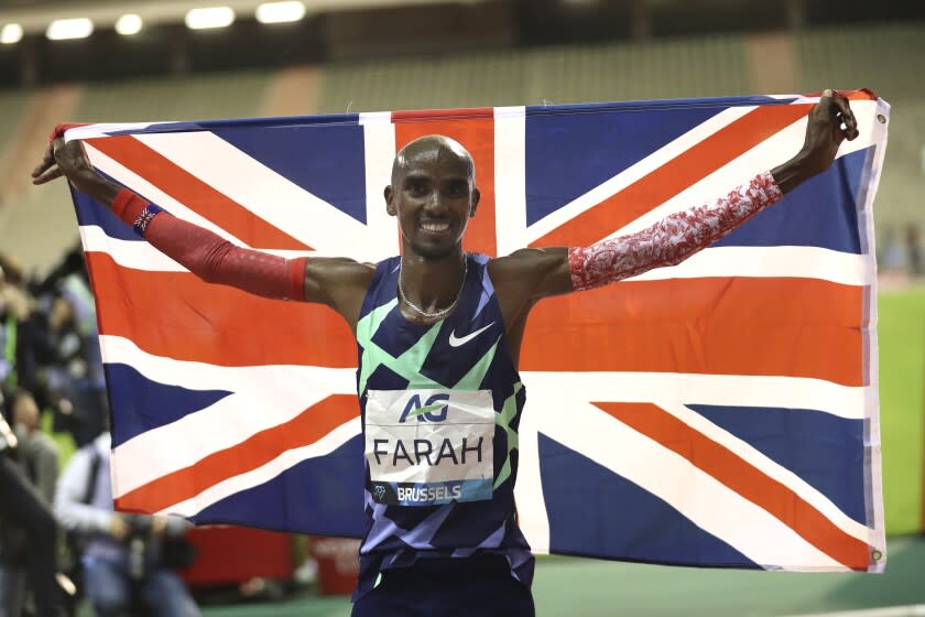 Great Britain's Mo Farah celebrates after winning the One Hour Men at the Diamond League.