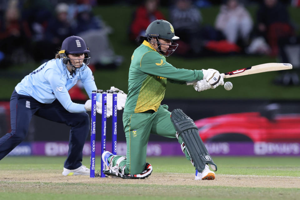 South Africa's Marizanne Kapp, right, bats against England during their semifinal of the Women's Cricket World Cup cricket match in Christchurch, New Zealand, Thursday, March 31, 2022. (Martin Hunter/Photosport via AP)