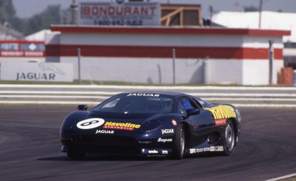 When Jaguar and TWR found themselves with more cars on hand than they had buyers awaiting delivery, a brilliant scheme came together: a one-make, made-for-television racing series that would raise awareness of the XJ220. Oddly, though the car was not certified for sale in the United States, the TV show was an American production. Ten cars were delivered to the Indianapolis headquarters of TV producer Terry Lingner, who put together a series of races to be driven by big-name, championship-winning pilots, all over 50 years of age. Fast Masters, it was called, and the races were telecast on ESPN’s “Saturday Night Thunder” slot. The biggest misstep here was the venue: Indianapolis Raceway Park, a 3/4-mile oval converted into a “road course” by the addition of what amounted to a big chicane, a left-right-left series of 90-degree corners. Originally, the idea was to run two 10-lap heats, one on the oval and one on the “road course,” and then a third, 12-lap finale with six laps of each layout. The driver names were, indeed, big, and they were drawn from all corners of the racing world. Participants included Bob Akin, Bobby and Donnie Allison, Buddy Baker, Derek Bell, Bob Bondurant, Vic Elford, Walker Evans, Gene Felton, George Follmer, David Hobbs, Paul Newman, Benny Parsons, Henri Pescarolo, Brian Redman, Rodger Ward, Bob Wollek, and, well, the list goes on . . . that’s just about half of it. <br><br>It was an embarrassment to all parties, now preserved for history on YouTube. Putting nine or 10 of the oversize 200-mph Jags on such a short, tight track with aggressive drivers well past their prime turned out to be a recipe for an expensive crash fest marked by more yellow flags and race stoppages than real racing action. After the first round, subsequent races were divided into a pair of eight-lap heats, both on the “road course” configuration, with only four or five cars in each. This pared down the carnage and repair costs without appreciably raising the entertainment value. After five events, cumulative points determined participants in a sixth championship round, which saw Bobby Unser, then 59, emerge with the series title and a $100,000 payday. Lingner tried to have Fast Masters renewed the following year, but 1993 was the one and only occurrence of what became known among wags as Crash Masters. It may have been poor publicity for the XJ220, but at least it was telecast in a market where you couldn’t buy the car anyway. — <em>Kevin A. Wilson</em>