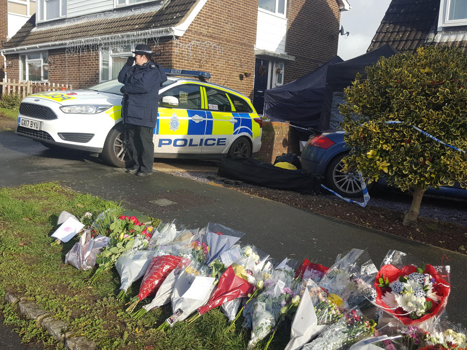 Floral tributes left for the victims in Hazel Way, Crawley Down, West Sussex. A man has been arrested on suspicion of murder over the deaths of two women attacked in Crawley Down, West Sussex. Picture date: Tuesday December 24, 2019. See PA story POLICE Crawley. Photo credit should read: Helen William/PA Wire