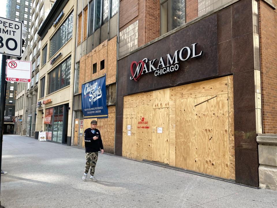 Dozens of businesses in downtown Chicago are boarded up on Oct. 14, 2020. Many have been boarded up since incidents of looting earlier in the summer.