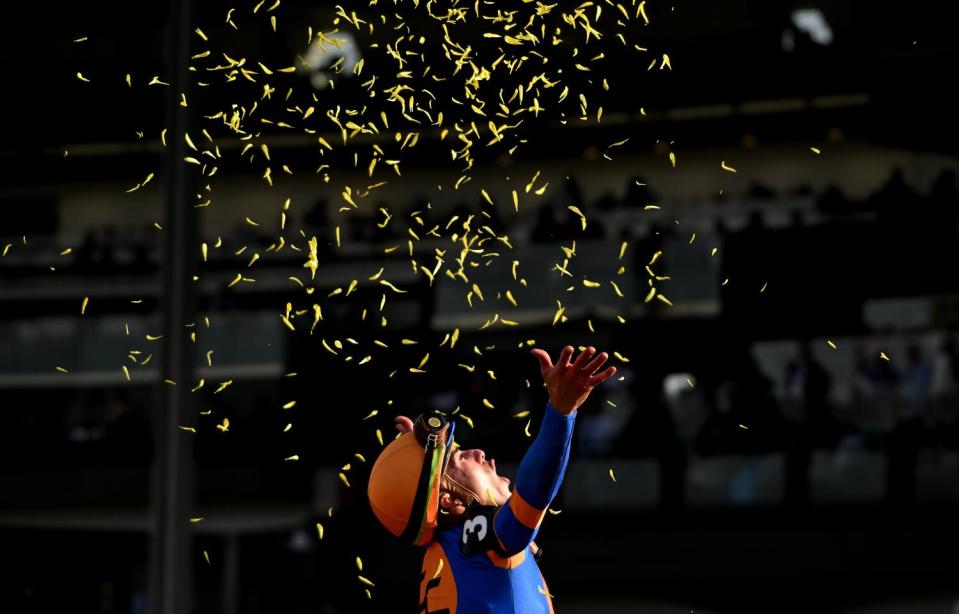 Jockey Irad Ortiz Jr. raises his arms at the end of the Breeders Cup Classic at Santa Anita.