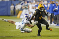 Arizona State running back Daniyel Ngata (4) breaks free from a tackle by BYU linebacker Payton Wilgar (49) in the second half during an NCAA college football game Saturday, Sept. 18, 2021, in Provo, Utah. (AP Photo/Rick Bowmer)