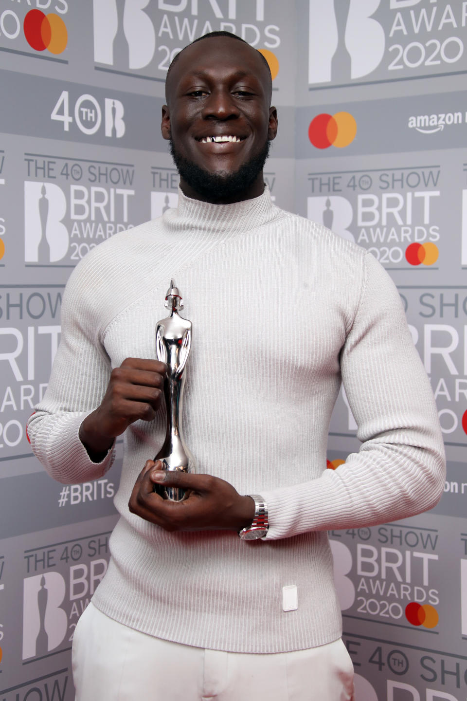 LONDON, ENGLAND - FEBRUARY 18: (EDITORIAL USE ONLY) Stormzy, winner of Male Solo Artist poses in the winners rooms at The BRIT Awards 2020 at The O2 Arena on February 18, 2020 in London, England. (Photo by Mike Marsland/WireImage)