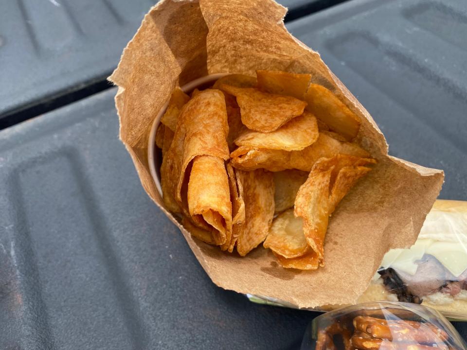 Buc-ee's beaver chips in a brown paper bag