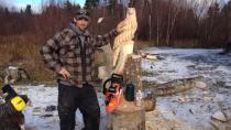 Carver Corey Chaulk creating art, with a chainsaw