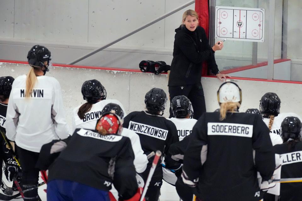 Courtney Kessel, head coach of the Boston-based team of the Professional Women's Hockey League, instructs her players during a team hockey practice ahead of their season, Monday, Nov. 20, 2023, in Wellesley, Mass.
