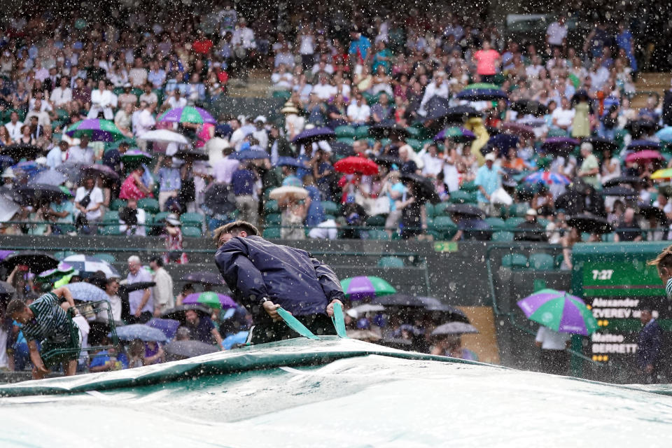 Rain stops play on court one as they cover the court on day six of the 2023 Wimbledon Championships at the All England Lawn Tennis and Croquet Club in Wimbledon. Picture date: Saturday July 8, 2023. (Photo by Victoria Jones/PA Images via Getty Images)